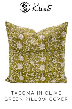 a green pillow with white flowers on it and the words, tacoma in olive green