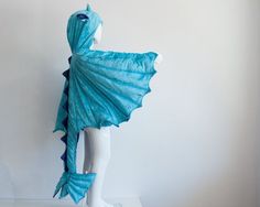 a mannequin with a blue dress on it's head