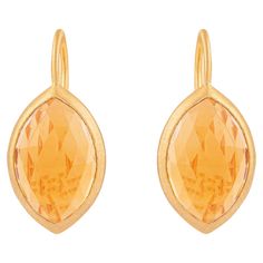 Crafted with precision and passion, our 18 Karat Gold 11 Carat Golden Topaz Drop Earrings embody elegance and sophistication. Each pair is a masterpiece of artistry, meticulously designed to capture the essence of timeless beauty. At the heart of these exquisite earrings lies a stunning 11-carat golden topaz, radiating warmth and allure. The lustrous 18 karat gold setting complements the natural brilliance of the gemstone, creating a harmonious union of luxury and grace. Inspired by the enchanti Luxury Yellow Gold Topaz Earrings, Formal Topaz Earrings, Luxury Gold Topaz Earrings, Modern Briolette Earrings For Formal Occasions, Formal Yellow Gold Topaz Earrings, Modern Formal Briolette Earrings, Classic Topaz Earrings For Formal Occasions, Luxury Topaz Earrings For Formal Occasions, Formal Topaz Drop Earrings