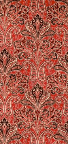 an ornate red and brown background with swirls