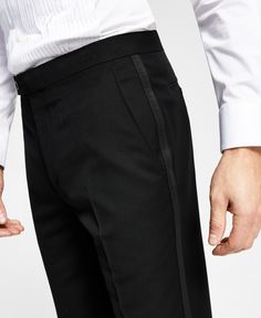 Make sure your style shines at your next sophisticated soiree with the crisp classic lines and shimmering grosgrain taping at the sides of these comfortable stretch suit pants from Alfani. Fitted Black Tapered Leg Pants, Tailored Tuxedo Trousers, Black Tailored Pants For Black-tie Events, Formal Black Pants With Belt Loops, Black Tailored Tuxedo Bottoms, Tailored Black Tuxedo Bottoms, Black Tuxedo Style Semi-formal Bottoms, Black Fitted Tuxedo Pants, Classic Black Slim Fit Pants