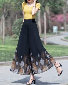 * Wide-leg skirt-shaped pants spun with high-quality chiffon fabric. * Elastic waistband on back, fixed waist on front, and A-line shape, make you look more taller and thinner. *Material: 100% chiffon *Let us know your regular size and overall height in your country. *The waist size and length can be customized. *Size: True to US size, can provide US 0 to US 20 , you can tell us your usual size and height when ordering. * Shipping: Free shipping Processing time: 5-7 working days Delivery time: 7 Black Wide Leg Pants With Elastic Waistband For Summer, Black Stretch Culottes For Spring, Casual Black Flowy Bottoms, Chic Flowy Bottoms For Fall, Spring Black Ankle-length Wide Leg Pants, Spring Black Wide Leg Pants With Elastic Waistband, Black Wide Leg Summer Culottes, Black Wide Leg Culottes For Summer, Black Wide Leg Pants With Elastic Waistband For Spring