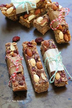 some kind of food that is on a table with candy canes and nuts around it