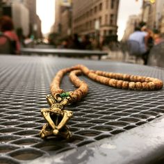 This Mala is made With 108 lotus seeds strung on electric green knotting cord displaying the Vajra or Dorje as the "guru" or focal bead. The vajra is the weapon of the Vedic rain and thunder-deity Indra, and is used symbolically by the dharma traditions of Buddhism, Jainism and Hinduism, often to represent firmness of spirit and spiritual power. Hand Knotted Spiritual Jewelry For Festivals, Green Spiritual Jewelry For Puja, Adjustable Spiritual Mala For Festivals, Spiritual Hand-knotted Jewelry For Festivals, Spiritual Mala For Festival Occasions, Adjustable Amulet Mala For Rituals, Handmade Gold Spiritual Mala, Adjustable 108 Beads Mala Amulet, Adjustable Green Spiritual Mala