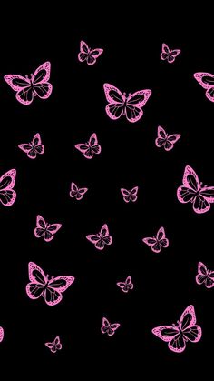 pink butterflies flying in the dark sky