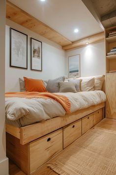 a bed sitting in the middle of a bedroom next to a dresser with drawers on it