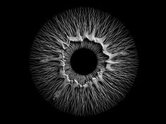 an eyeball is shown in the dark with white streaks on it's iris