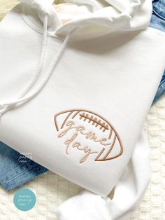 Game day Football Shirt, Embroidered Football Game Pullover, Football Season Womens Football Shirt, Football Game Day Sweatshirt, game shirt Perfect gift for engagement, bridal showers, and Christmas!! first picture is white hoodie with #6 football and #31 game day thread ---HOW TO ORDER---   FOR EACH SHIRT CHOOSE: **Shirt type, size and color thread color Please note: If we don't receive all needed custom details, , we will make it to the default, thread color and sleeve type based on the color Football Sweatshirt Ideas, White Cotton Hoodie For Game Day, White Sporty Hoodie With Embroidered Text, Sporty White Hoodie With Embroidered Text, White Embroidered Hooded Hoodie, Football Season Game Day Cotton Hoodie, Cotton Hoodie For Football Season Game Day, Gift For Engagement, Womens Football Shirts