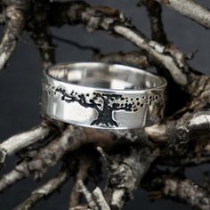 Introducing the Tree of Life ring - a perfect choice for nature jewelry lovers! Made with genuine sterling silver, this stunning wedding and engagement ring features a beautiful Tree of Life design. This ancient symbol represents strength, wisdom, and interconnectedness - making it the ideal promise ring or gift for your loved one. But that's not all...You can add FREE personalization to make this ring even more special. Whether you want to engrave initials or a meaningful date, we'll help you create a truly unique piece of jewelry. Handcrafted by skilled artisans in the Celtic style, this tree ring is sure to capture attention wherever you go. Perfect as a widding band or bridesmaid gift too! Celebrate your love for nature with our gorgeous Tree of Life Sterling Silver Ring today. Order n Nature Wedding Ring, Ring Tree, Tree Of Life Ring, Celtic Engagement Rings, Life Ring, Tree Ring, Engraved Initials, Celtic Style, Tree Rings