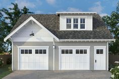 a two car garage with three windows on the top floor