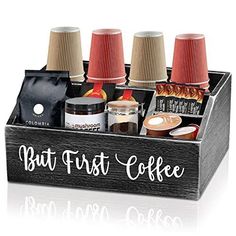 a wooden box filled with different types of coffees and condiments on top of each other