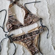 Martha Aponte Selena String Bikini. Size Small. Selena Safari Boho Print. This Designer Bikini Is Gorgeous! The Bottom Is Adjustable On The Sides. Both Top And Bottom Are Self Tie. Top And Bottom Are Included!! Fully Lined! Neutral Color Story! Brand New Tags Attached!! Sa Fitted Beige Halter Neck Swimwear, Beige Halter Neck Swimwear For Beach Season, Beige Halter Neck Swimwear For Beach, Summer Cream Swimwear For Vacation, Bohemian Beige Swimwear For Beach Party, Summer Beige Halter Neck Swimwear, Fitted Beige Swimwear For Beach Party, Beige Halter Neck Summer Swimwear, Cream Beachwear Swimwear For Vacation