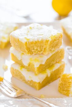 three pieces of lemon bars stacked on top of each other