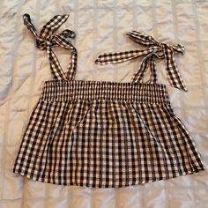 Cropped Plaid Strap With Bows Top Black Cotton Top With Tie Straps, Black Cotton Tops With Tie Straps, Black Tops With Tie Straps For Beach, Black Tie Strap Tops For Beach, Chic Plaid Tops For The Beach, Chic Plaid Tops For Beach, Casual Crop Top With Tie Straps For Vacation, Trendy Plaid Tops For Vacation, Textiles Clothing