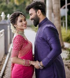 a man and woman standing next to each other