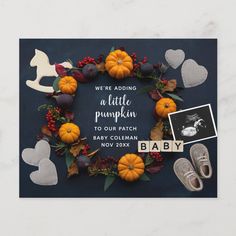 a baby announcement with pumpkins and other decorations