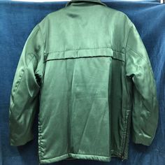 "Vintage 1950's Emerald Green Work Jacket. Zip front, 4 pocket. Inside cuff and fully lined. Issued by Nudelman Uniforms with Portland and Seattle locations. Beautiful old school vibe. Great color. Good vintage condition, but note it needs a cold gentle cycle wash and tumble dry on air setting or have it dry cleaned. Only discernible you close, it has a few areas of wear and dirt and just need to get washed out. Otherwise no stains rips or smells. I've oiled both side zippers so they run again. Vintage Green Outerwear For Sports, Vintage Winter Fleece Jacket With Pockets, Functional Green Fleece Jacket, Vintage Outdoor Fleece Jacket, Vintage Embroidered Green Outerwear, Golden Fleece, Bellingham Wa, Work Jacket, Japanese Silk