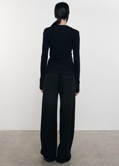 This easy fitting top is cut from the brand's signature soft cashmere jersey and has a feminine U-shaped neckline. Understated and timeless, it embodies the perfect combination of a luxurious T-shirt and lightweight sweater. Featuring ribbed cuffs with thumbholes and a signature back seam. Light Weight Sweater, Black Pants, Cashmere, T Shirt, Black