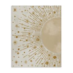 an art print with gold stars and sunbursts in the center on a white background