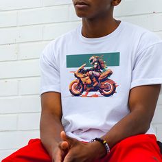 This t-shirt features a stunning piece of original digital art showcasing an adventure motorcycle in all its glory. With bold lines and vivid colors, the artwork captures the spirit of adventure and the freedom of the open road. Whether you're a motorcycle enthusiast or simply appreciate eye-catching design, this t-shirt is sure to make a statement. Wear it on your next ride or out on the town to show off your love for adventure and art. The unisex soft-style t-shirt puts a new spin on casual co White Short Sleeve T-shirt For Motorcycling, Biker T-shirt With Sublimation Print, White Sublimation Print T-shirt For Biker Events, White Moto Crew Neck T-shirt, White Moto Style Short Sleeve T-shirt, White Short Sleeve Moto T-shirt, White Short-sleeved Moto T-shirt, Motorcycling Short Sleeve Screen Print T-shirt, Casual Motorcycling T-shirt With Screen Print