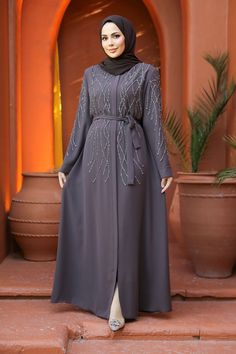 Elevate your style with our Women Plus Size Abaya in Smoke Gray. This timeless piece is designed for comfort and elegance, making it a perfect addition to your wardrobe. Features: Plus Size Fit: Tailored to provide a flattering and comfortable fit for all body types. Long Sleeve: Offers a modest and graceful look, perfect for any occasion. Zip Front: Easy to wear and ensures a secure fit, adding convenience to style. Self Belt: Allows you to adjust the fit and showcases your waistline beautifull Gray Abaya, Plus Size Abaya, Abaya For Women, Abaya Online, Abaya Design, Evening Jumpsuit, Plus Size Fits, Maxi Dress Formal, Women Plus Size