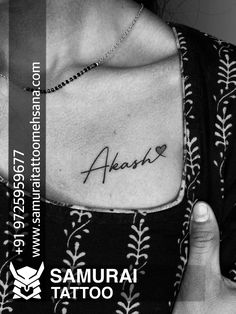 a woman with a tattoo on her chest and the words ahana written in cursive font