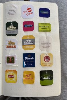 an open book with various stickers on it