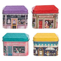 four ceramic boxes with different shops on them in the shape of houses, buildings and street signs