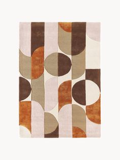 an area rug with various shapes and colors on it, including brown, white, orange and beige circles