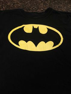 DC Comics Batman black T-shirt, kid size XXL (18) black. Short sleeve, no stains,  rips or tares.  Condition is Pre-owned. Shipped with USPS First Class Package. Black Short Sleeve Top For Fan Conventions, Black Pre-shrunk Shirt For Fan Conventions, Black Tops With Screen Print For Fan Conventions, Black Screen Print Tops For Fan Conventions, Black Crew Neck T-shirt With Pop Culture Style, Black Graphic Tee For Fan Conventions, Black Band Merch Tops For Fan Conventions, Band Merch Black Tops For Fan Events, Black Graphic Print Top For Fan Conventions