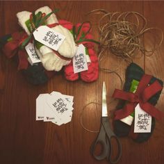 scissors, tags and yarn on a wooden table