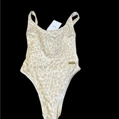 Balmain Made In Italy 100% Authentic F36; Us 4; Small Gorgeous Taupe Animal Print On A White Swimsuit. A Gold Plaque With The Balmain Name On It. This Swimsuit Is Simple, Elegant And Very Sexy!!! Brand New With Tags!!!! Luxury Fitted Swimwear For Summer, Luxury One-piece Swimwear For Summer, Luxury One-piece Swimwear, Chic White One-piece For Party, Beige Bodysuit For Vacation, Luxury Fitted Swimwear For Vacation, Elegant Beige One-piece Swimwear, Elegant Bodysuit For Vacation, Fitted Beige Bodysuit For Poolside