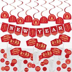 a red and white new year party decoration with chinese decorations, streamers and paper cutouts