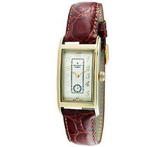 Sixties style. Show off your flair for vintage-inspired looks with this weathered dial watch. The white, rectangular dial has stylistic applique and hands for easy-to-read time keeping. The contoured case has a slight bow for added comfort, and the leather strap easily adjusts to fit your wrist. From Peugeot.  Goldtone or Silvertone. Classic Brown Rectangular Watch, Classic Rectangular Watch With Analog Display, Classic Analog Rectangular Watch Accessories, Classic Rectangular Analog Watch, Retro Watch Accessories With Rectangular Analog Dial, Retro Watch Accessories With Analog Display And Rectangular Dial, Vintage Rectangular Analog Watch, Vintage Rectangular Analog Watches, Vintage Brown Watch Accessories With Rectangular Dial