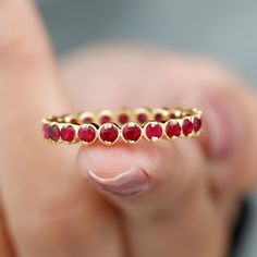 Product Details This Ruby Ring is unique and a beautiful jewelry for your loved ones. It features with Round Cut Ruby in full eternity pattern in Bezel Setting on Eternity Ring. This Full Eternity Ring is crafted in Solid Gold. Either go alone or stack it with other rings, in both the ways it will look flawless. Product Information SKU SHP-RINGS0821169419 Width 1.7 mm Height 3.2 mm Weight 2.40 gm (Approximate) RUBY INFORMATION No.of Stones 21 Pieces Total Weight 2.08 Carat (Approximate) Dimensio Full Eternity Ring, Stackable Ring, Ruby Ring, Stackable Rings, Eternity Ring, Bezel Setting, Round Cut, Beautiful Jewelry, Solid Gold