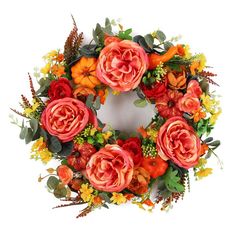 an orange and red wreath with flowers on it's side, isolated against a white background