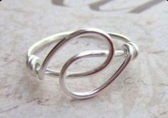 a silver ring sitting on top of a table