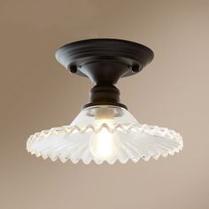 Introducing the PÃ©nÃ©lope Vintage Glass Radial Mini Ceiling Lighting, a stunning addition to your home decor. This 1-Light Balcony Semi Flush fixture combines classic elegance with a touch of vintage charm. Crafted with a beautiful radial design, the glass shade exudes an ethereal glow, dispersing soft light throughout your space. The semi flush installation ensures easy and hassle-free setup, perfect for any ceiling height. With its compact size, this lighting solution is ideal for smaller spaces like balconies or entryways. The PÃ©nÃ©lope Vintage Glass Radial Mini Ceiling Lighting is both functional and stylish, making it a must-have for any e-commerce enthusiast looking to elevate their interior design game.Size: 5 to 9 Inch Fixture Width: 8.5" Fixture Height: 5.5" Bulb Included: No Nu Semi Flush Mount Light, Radial Design, Interior Design Games, Brass Lantern, Flush Mount Light, Metal Hanging Lights, Semi Flush Mount Lighting, Mount Light, Modern Ceiling