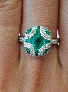 Stunning Emerald and diamond art-deco band. A beautifully crafted. The Emeralds are set in a flush design for a smooth finish. Art deco vintage style ring. The Emeralds and diamonds are mounted in 14K white gold. It is set with 0.17 carats of white diamonds and 1.55 carats of emeralds. Currently in size 6 1/2. Exquisite 14k White Gold Gia Certified Diamond Ring, Classic Silver Emerald Ring Gia Certified, Classic Silver Gia Certified Emerald Ring, Exquisite Diamond Emerald Ring For Anniversary, Exquisite Platinum Emerald Ring With Prong Setting, Platinum Emerald Ring With Halo Setting For Anniversary, Gia Certified Art Deco Platinum Jewelry, Gia Certified Oval Emerald Ring In Art Deco Style, Exquisite Platinum Emerald Ring With Brilliant Cut