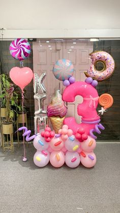 balloons and decorations are arranged in the shape of numbers