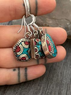 Beautiful boho style short dangle earrings, made with white metal and unique details with brass and small pieces of Turquoise and Coral. In the pictures you will see a number that represents each style for you to choose from. Easy and fun earrings that you will be able to wear with your everyday outfits. Style #1- Made in a Hexagon shape, the earrings are 1.8cm- 0.75 inch long by 1.8cm, 0.75 inch wide. They have a drop length of 3cm- 1.25 Style #2- Made in a Teardrop shape, this earrings are 1.8 Adjustable Bohemian Crystal Earrings, Festival Drop Earrings With Dangling Charms, Festival Jewelry Drop Earrings With Dangling Charms, Festival Jewelry With Dangling Drop Earrings, Nickel Free Crystal Drop Earrings For Festival, Nickel-free Crystal Drop Earrings For Festival, Bohemian Dangle Cartilage Earrings For Gifts, Bohemian Dangle Cartilage Earrings Gift, Nickel-free Bohemian Pendant Earrings