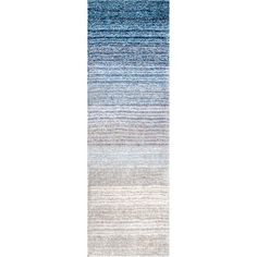 a blue and white rug with vertical stripes on the bottom, in front of a white background