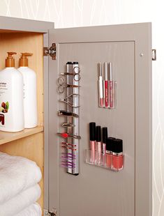 an open cabinet with cosmetics and toiletries in it