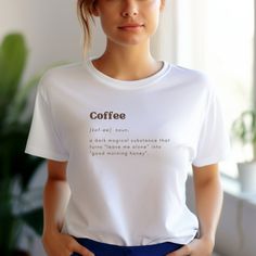 Coffee Addict T-Shirt Funny Definition Shirt Gift Idea for Coffee Lover Tshirt Unisex Comfort Shirt Graphic T-shirt  T-SHIRT: The unisex heavy cotton tee is the basic staple of any wardrobe. It is the foundation upon which casual fashion grows. The shoulders have tape for improved durability. Consisting of 100% cotton for year-round comfort that is sustainable and highly durable.  The classic fit of this shirt ensures a comfy, relaxed wear while the crew neckline adds that neat, timeless look th Casual Coffee-colored Screen Print T-shirt, Coffee Colored Relaxed Fit T-shirt With Slogan, Coffee Color Crew Neck T-shirt For Everyday, Coffee Color Short Sleeve T-shirt With Screen Print, Casual Coffee Slogan T-shirt, Casual Coffee Colored Slogan T-shirt, Casual Coffee T-shirt With Slogan, Casual Coffee Pre-shrunk Tops, Short Sleeve T-shirt With White Print For Everyday