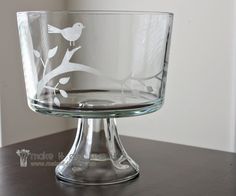 a glass bowl sitting on top of a wooden table