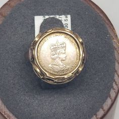 Vintage 8K Yellow Gold 1965 Aureum Elizabeth Coin Ring Size 6. Stamped 333 inside band. Ring is 16mm wide. Weighs 1.3 dwt. We do not check prongs for wear or stones for looseness. All items are sold AS IS, noting that we are a resale shop so everything here had a previous owner! We will include flaws in the description when noted. This is one of the reasons our items are more affordable than new at a jewelry store. Are these stones real or fake? Aside from diamonds, we do not know if any gemstones are natural or synthetic. We will state on certain gemstones, that we know 100%, if they are created or fake due to their lack of inclusions. For this reason, we do not sell any diamonds without inclusions, and the larger diamonds (half ct+) are soft graded. In recent years, synthetic gemstones a Victorian Gold Engraved Collectible Ring, Heirloom Signet Ring For Commemoration, Heirloom Round Signet Ring For Commemoration, Antique Coin-shape Engraved Signet Ring, Antique Gold Signet Ring For Commemoration, Antique Coin Shaped Engraved Signet Ring, Gold Antique Signet Ring For Commemoration, Antique Engraved Coin Signet Ring, Gold Coin-shaped Engraved Ring