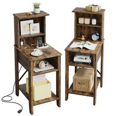 two wooden desks with open shelves on each side, one has a lamp and the other is a book shelf