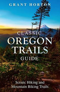 the book cover for classic oregon trails guide, featuring trees and mountains in the background