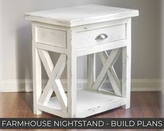 a white end table with an x design on the top and one drawer at the bottom