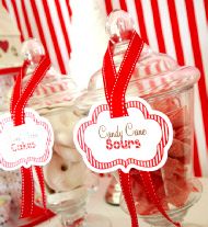 candy bar with red and white candies in glass containers